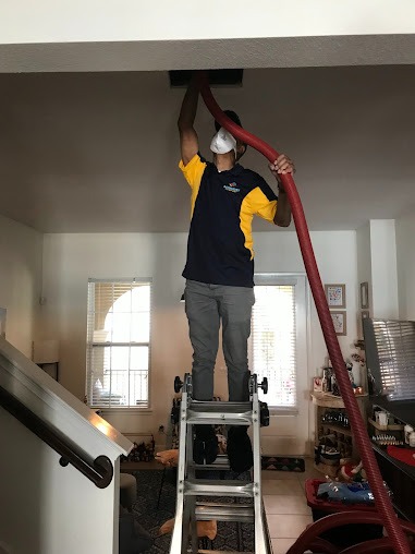 Homeowner enjoying clean air and comfort from a new AC installation